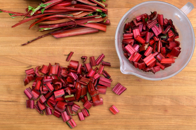 Chard stems chopped on cutting board