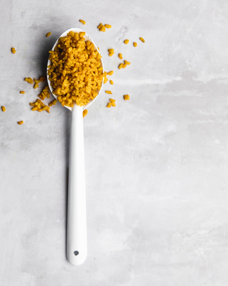 Fragrant Golden Rice in a serving spoon